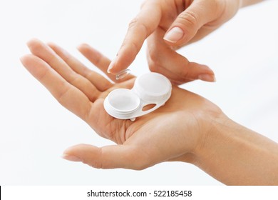 Contact Eye Lens. Closeup Of Woman Hands Holding White Eyelense Container. Beautiful Woman Fingers Holding Eye Lense Box. Health And Eyes Care Concept. High Resolution 