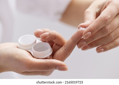 Contact Eye Lenses. Woman Hands Holding Contact Eye Lens. Woman Hands Holding White Eye lens Container. Beautiful Woman Fingers Holding Eye Lens Box. Health And Eyes Care Concept. High Resolution 