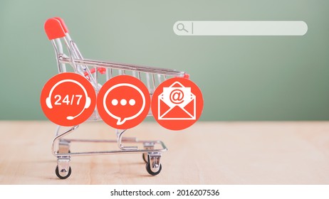 Contact Icon On Red Round Paper Cut With Search Bar And Shopping Cart In Soft Focus On Wood And Green Background For Shopping On Line, E-commerce, Search For Customer, Contact 24 Hours 7 Days