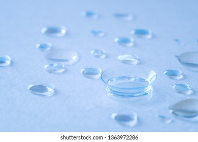 Contact lenses and water droplets, ultra-wetting and comfortable wearing of contact lenses - Shutterstock ID 1363972286