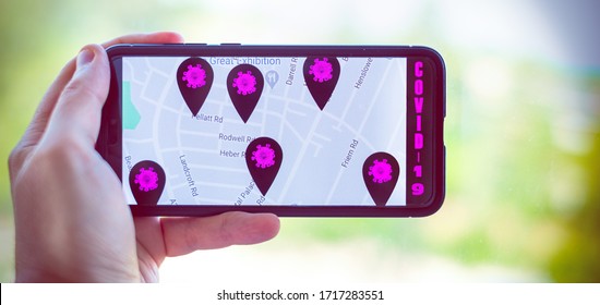  contact tracing app horizontal background with hand holding cell phone - Shutterstock ID 1717283551
