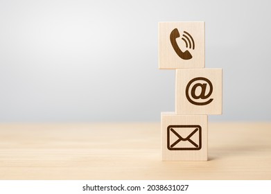 Contact us concept, Wood block symbol telephone, mail, and address on desk. Close-up Of Various Contact Options on wooden cubes. Wood block symbol telephone, mail, and address on desk. copy space - Shutterstock ID 2038631027