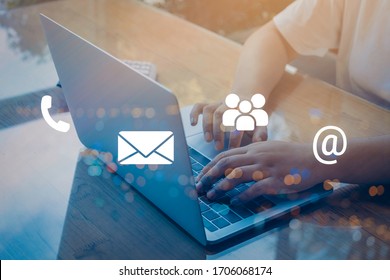 Contact us or Customer support hotline people connect. Businessman using a laptop with the (email, call phone, mail) icons.