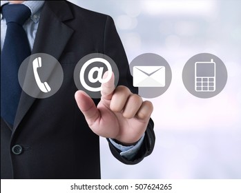 CONTACT US (Customer Support Hotline People CONNECT ) Businessman Touching A Touch Screen On Blurred City Background