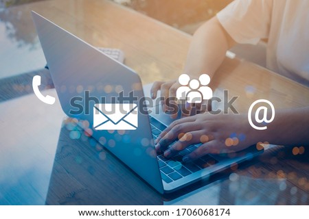 Contact us or Customer support hotline people connect. Businessman using a laptop with the (email, call phone, mail) icons.