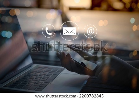 Contact us or Customer support hotline people connect. Businessman using a laptop computer with the (email, call phone, mail) icons.