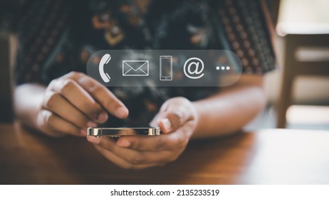 Contact Us Support Service and Information Connect Concept, Female's Hands is Using Mobile Phone and Laptop for Corporate Information Contact Via Email Support. Customer Communication Contact Services - Shutterstock ID 2135233519