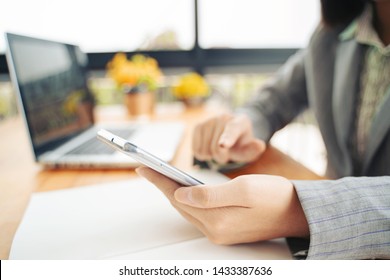 contact us,businesswoman work by modern devices, she uses digital tablet computer ,mobile smartphone New marketing plan researching mobile phone,email, telephone ,e-mail address wifi icon concept 