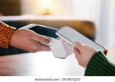 Contactless Mobile Payment Transaction Between Two Individuals with Modern Technology - Powered by Shutterstock