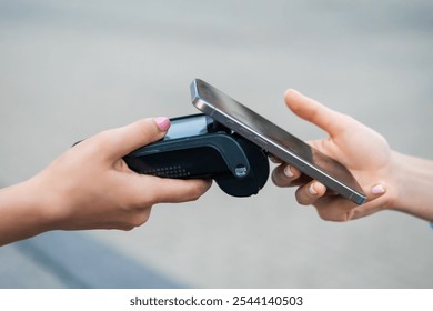 Contactless payment processing at a retail store using a terminal and smartphone.
