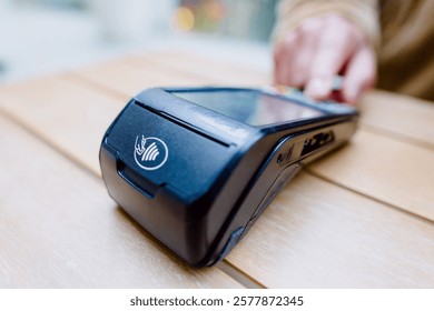 Contactless payment processing via nfc-enabled terminal, showcasing digital banking convenience and secure transaction method