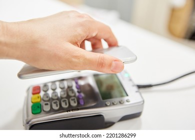 Contactless Payment As A Service In Retail With Smartphone App And NFC Reader