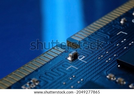 contacts of a microchip of random access memory close-up.