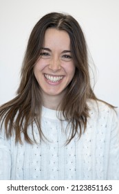 Contagious Smile Of A Cute Caucasian Young Woman On White Background