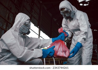 Contain Chemical Spill to Red Garbage Bags After Absorb, Part of Steps for Dealing with Chemical Spillage, Spill Cleanup Procedures, Basic Practical Training for Chemical Spill Clean-up.