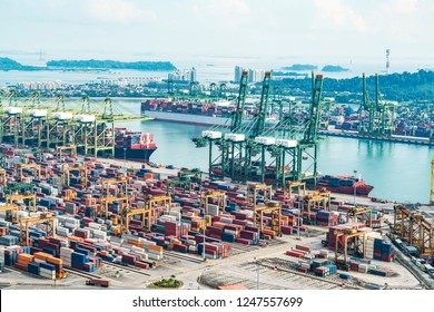 Container Cargo freight ship with working crane loading bridge in shipyard