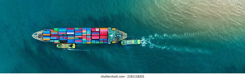Container cargo ship was dragged by tug boat to international cargo port shipyard for service transport, logistic service transportation and maintenance insurance concept - Shutterstock ID 2181118201