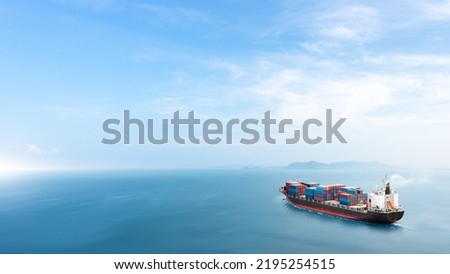 Container cargo ship in the ocean at sunset blue sky background with copy space, Nautical vessel and sea freight shipping, International global business logistics transportation import export concept