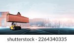 Container handler forklift lifting in shipping yard with stack of colorful containers box background, copy space, Logistics import export goods of freight carrier and transportation industry concept