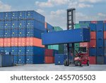 Container handler forklift lifting in shipping yard. Crane lifting up container in yard. Shore crane loading containers in freight ship.