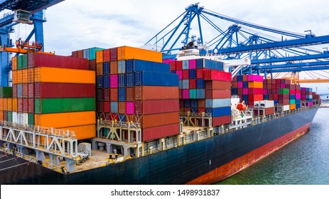 Container loading in a Cargo freight ship with industrial crane,  shipping in import and export business logistic company.