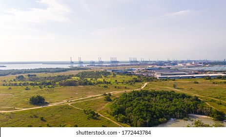 the container port of Klang. Aerial view to the container cranes of the east port of the sound port. Landscape view over the sound valley at Pulau Indah. Destination for large container cargo ships - Powered by Shutterstock