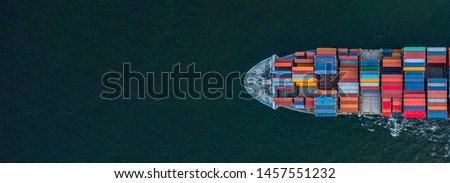Container ship carrying container for import and export, business logistic and transportation by container ship in open sea, Aerial view container cargo ship with copy space for design banner web