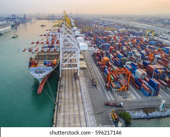 container ship commercial vessel alongside in port for loading and discharging  containers services in maritime transports in World wide logistics  - Shutterstock ID 596217146