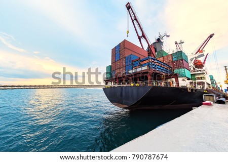 container ship commercial vessel alongside in port for loading and discharging containers services in maritime transports in World wide logistics 
 [[stock_photo]] © 