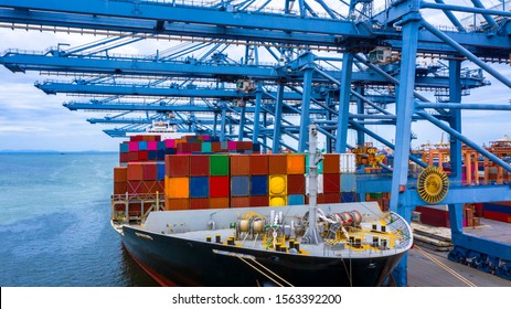 Container ship in export and import business and logistics, Container ship berthing port. - Shutterstock ID 1563392200