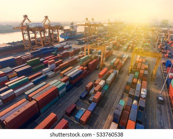 Container ship in export and import business and logistics. Shipping cargo to harbor by crane. Water transport International. Aerial view - Shutterstock ID 533760538