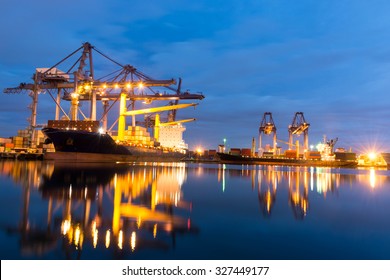 Container Ship In The Harbor Of LeamChabang, Night Shot. Cloudy Sky.