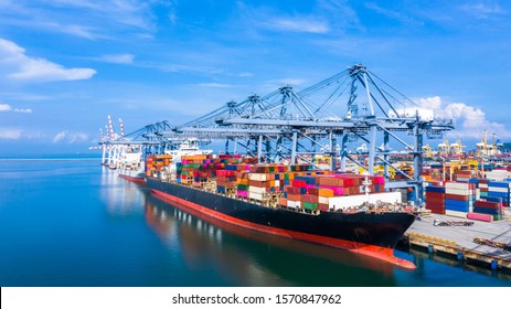 Container ship at industrial port in import export business logistic and transportation of international by container ship in the sea, Container loading in cargo freight ship with industrial crane.