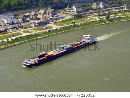 Container ship on the Rhine River, Rhine Valley - UNESCO World Heritage Site, Germany