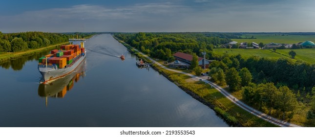 Container Ship, Pilot Boat In Action By Station For Vessels Navigating On The Kiel Canal. German Pilot Boats With Container Ship By Changing Of Marine Pilot. Pilot Station Rüsterbergen, Schülp Germany