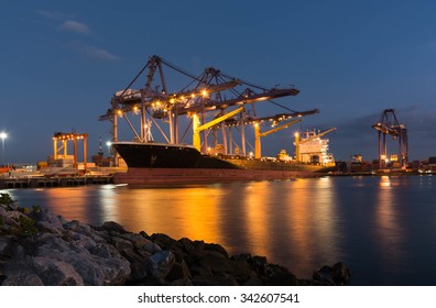 The Container Ship In Port During Loading Container Into Ship , Leamchabang Thailand. Night Time