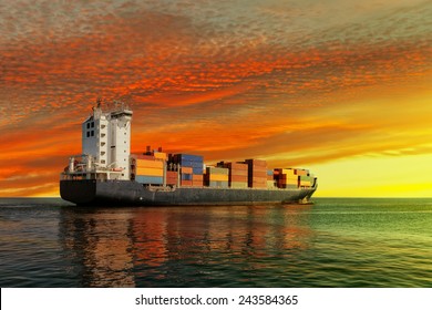 Container Ship At Sunset In The Sea.