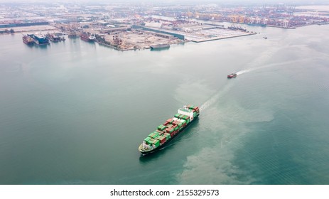 Container Ship Transporting Cargo Logistic Import And Export Goods Internationally Around The World, Including Asia Pacific And Europe, Aerial View Photograp From Drone 