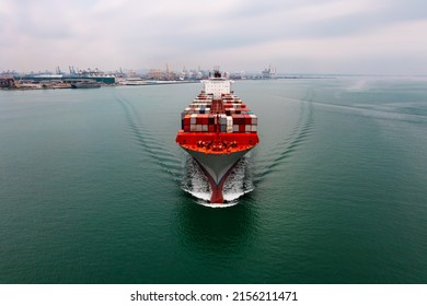 Container Ship Transporting Cargo Logistic Import And Export Goods Internationally Around The World, Including Asia Pacific And Europe, Aerial View Photograp From Drone 