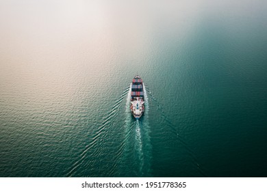 Container Ship Transporting Large Cargo Logistic To Import Export Goods Internationally Around The World, Including Asia Pacific And Europe, By Sea Or Mediterranean Aerial View Photograph From Drone 
