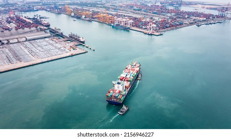 Container ship and tugboat draging to dock transporting cargo logistic import and export goods internationally around the world, including Asia Pacific and Europe, Aerial view photograph from drone 
