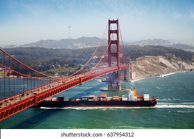 Container Ship Under Golden Gate Bridge In San Francisco