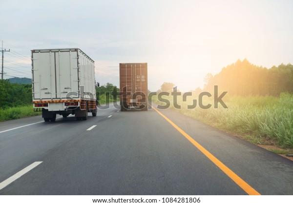 container\
trucks Logistic by Cargo truck on the road\
.