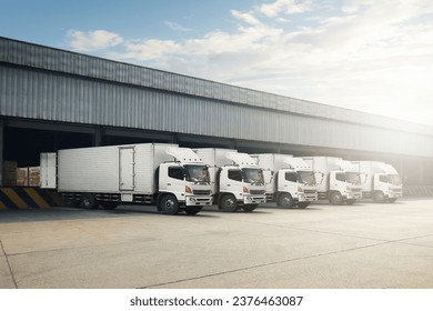 Container Trucks Parked Loading Package Boxes at Dock Warehouse. Cargo Container. Distribution Warehouse Shipping. Supply Chain, Shipment Boxes. Freight Truck Logistics, Cargo Transport.