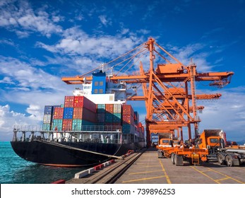 The container vessel  during discharging at an industrial port and move containers to container yard by trucks. - Shutterstock ID 739896253