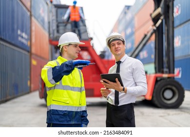 Container yard manager briefing work plan with the supervisor at container yard warehouse. Container yard warehouse, Cargo Shipping Import and Export industry. Logistic shipping yard business.