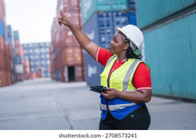 Container yard operations female worker directing cargo movement shipping terminal photo industrial setting close-up view empowerment