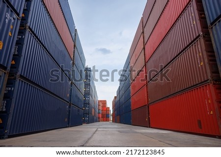 container yards with wide angle photo. logistic cargo freight ship for import export container yard with blue sky background.