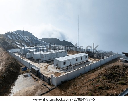 Containerized substation power facility installed in mountainous area with solar panels
