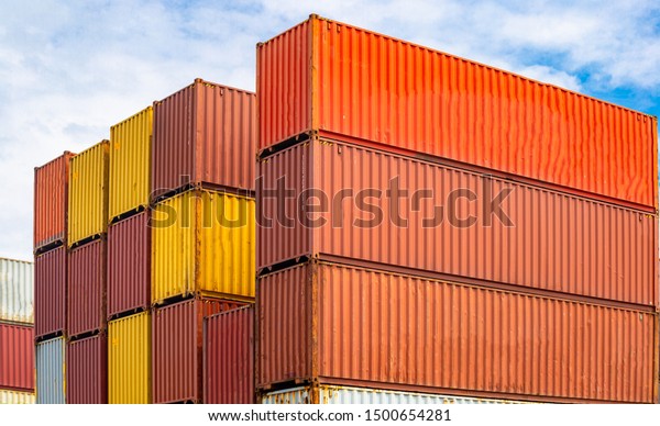 Containers box from\
Cargo freight ship for import and expor, logistics transportation\
container terminal.